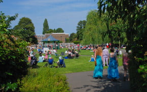 people sitting in park, bandstand
