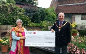 The Mayor of Farnham, Cllr John Ward presents a cheque to Jo Aylwin.