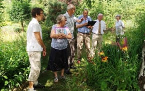 Group of judges in a garden.