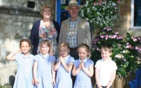 Mayor and Mayoress of Farnham with five school children.