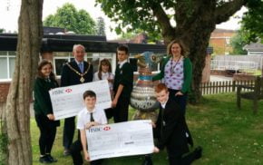 School children receive grant cheque from Mayor.