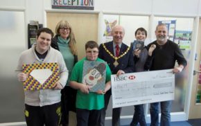 Group of young people with the Mayor and a large cheque.