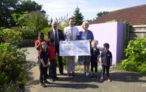 John Ward presents large cheque to the Ridgeway School