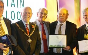 Five males including the Mayor with certificates.