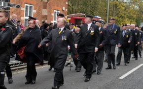 People marching in a remembrance parade.