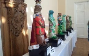 Six large decorated otters.