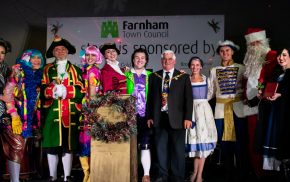 Pantomime cast and Mayor on stage.