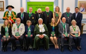 Mayor centre with group of people wearing medals