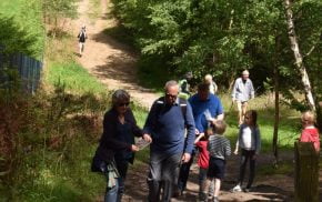 Family walking through woods.