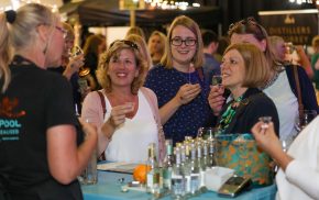 Four females sampling gin