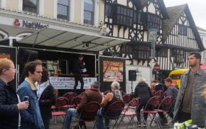 People watching a demonstration at a food festival