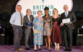 Row of six people holding awards.