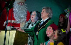 Father Christmas, two females and pantomime characters