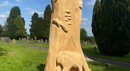 Animals carved from a tree trunk.