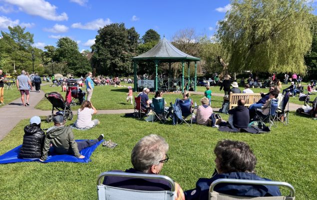 Groups of people sitting in a park