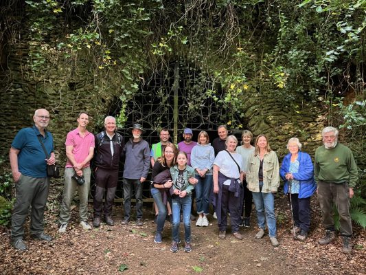 Group of people in the woods smiling