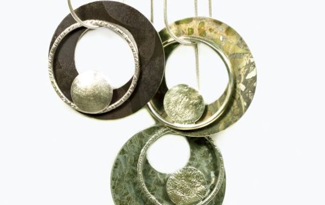 artwork showing hanging circular golden shapes