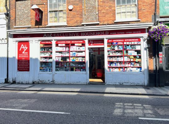 Photo of a red and white shop selling household goods