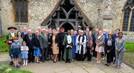 Group of people outside a church.