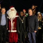 Group of people including the Mayor, Father Christmas , town crier and elves