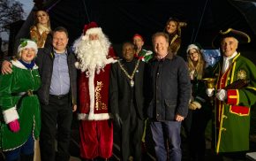 Group of people including the Mayor, Father Christmas , town crier and elves